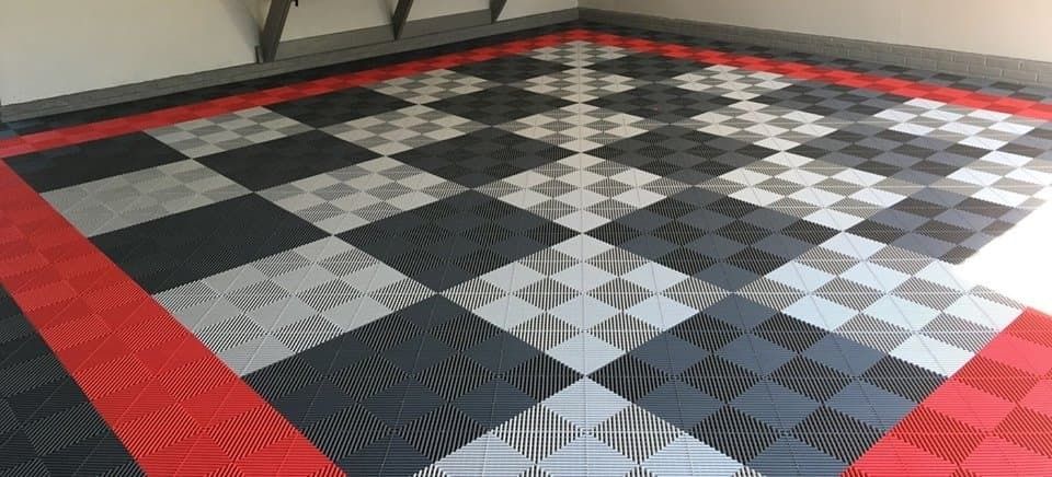 Checkered floor with red border in a room.