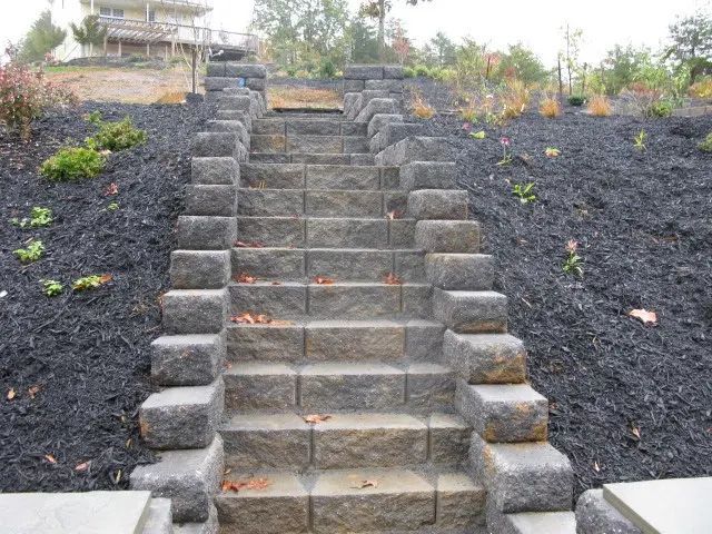 A set of stone stairs going up a hill