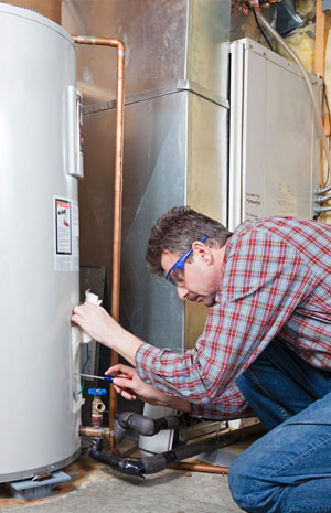 Man fixing a heating machine