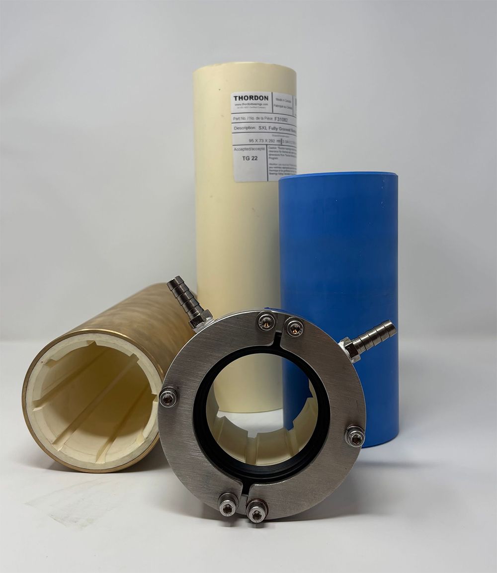Three different colored pipes are stacked on top of each other