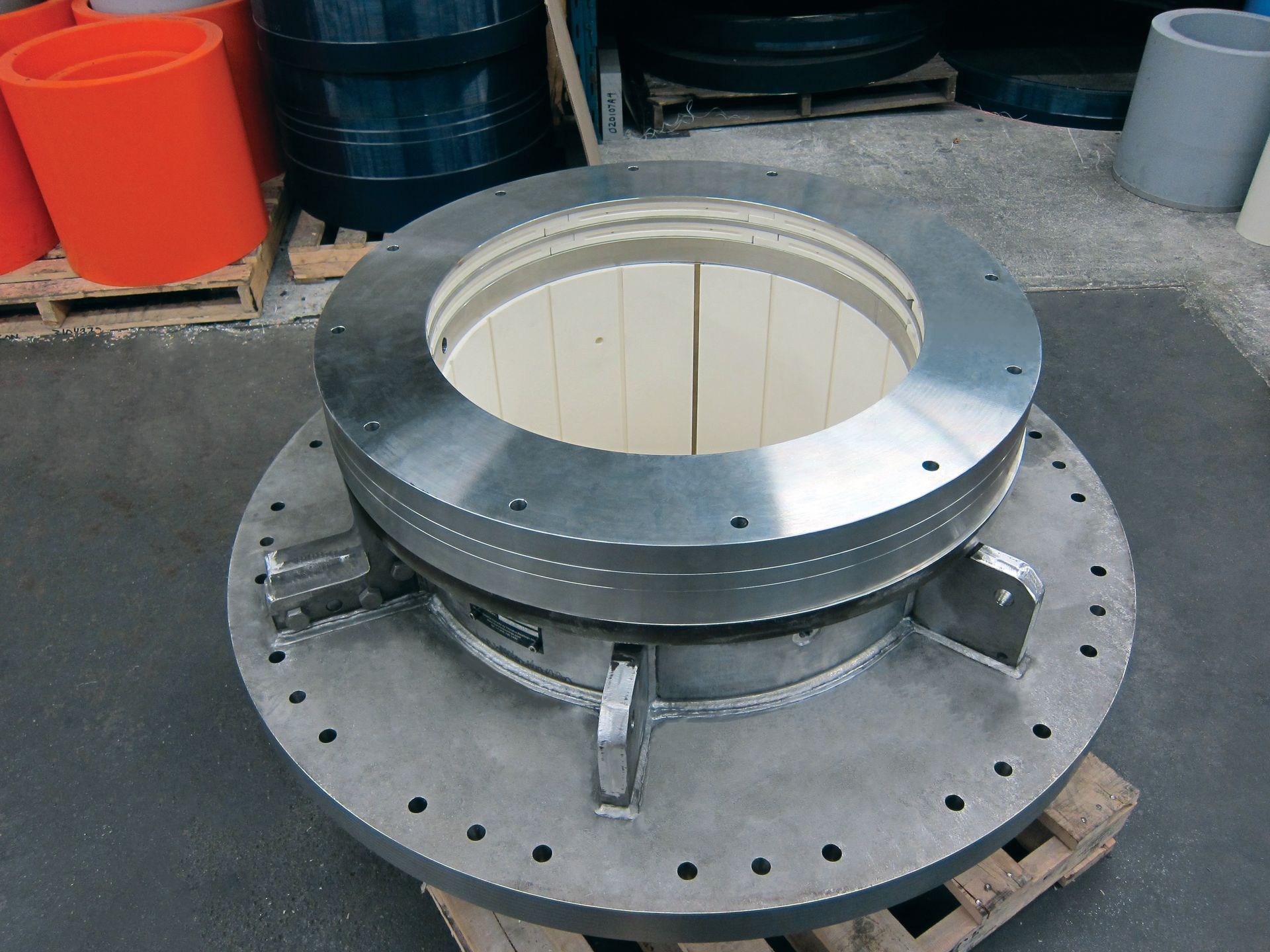 A large metal object is sitting on a wooden pallet