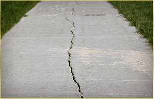 Walkway cracked cement lifting