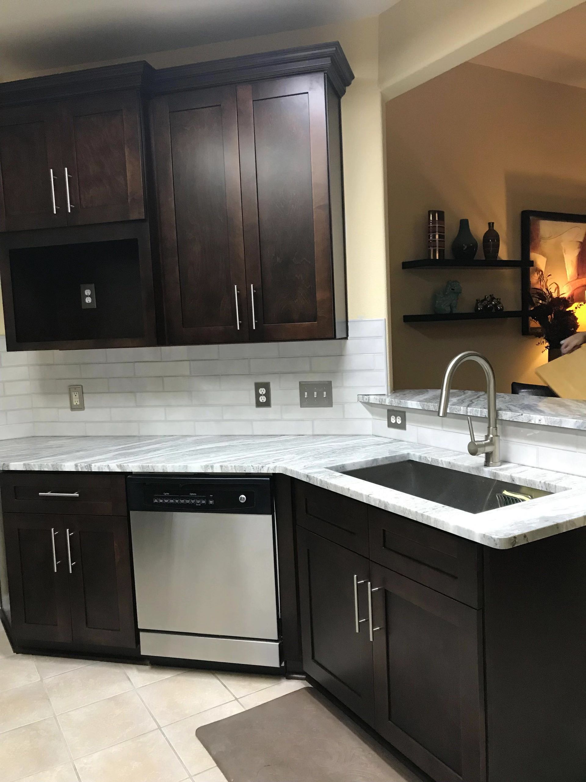 A kitchen with stainless steel appliances and wooden cabinets