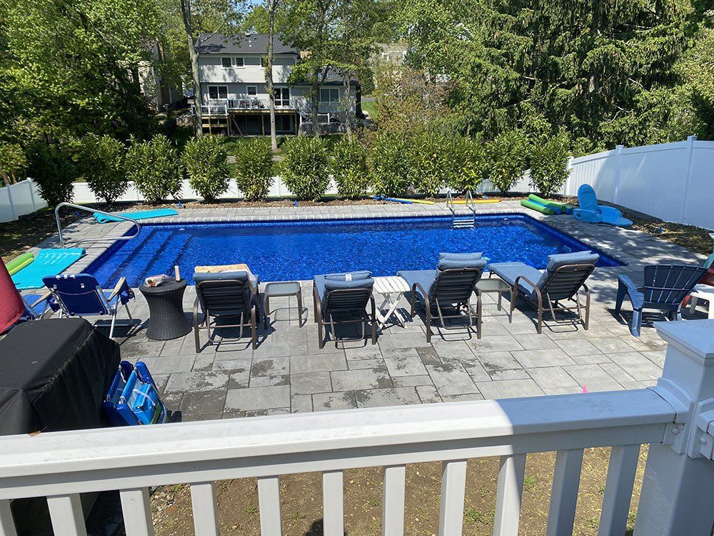 Swimming pool with sun lounger