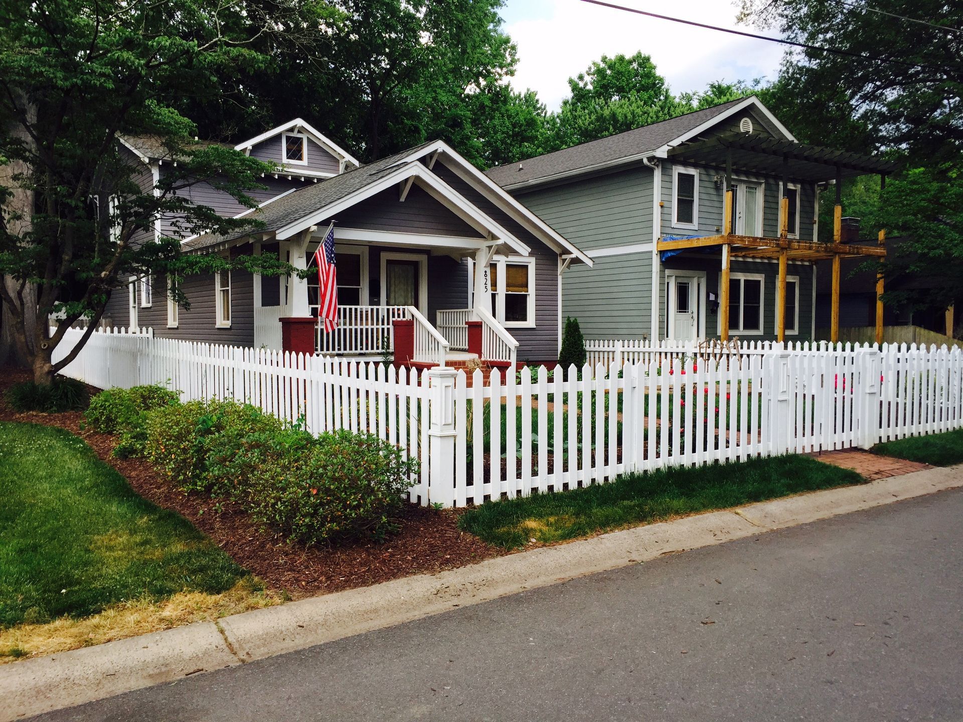 A house with a white picket fence around it
