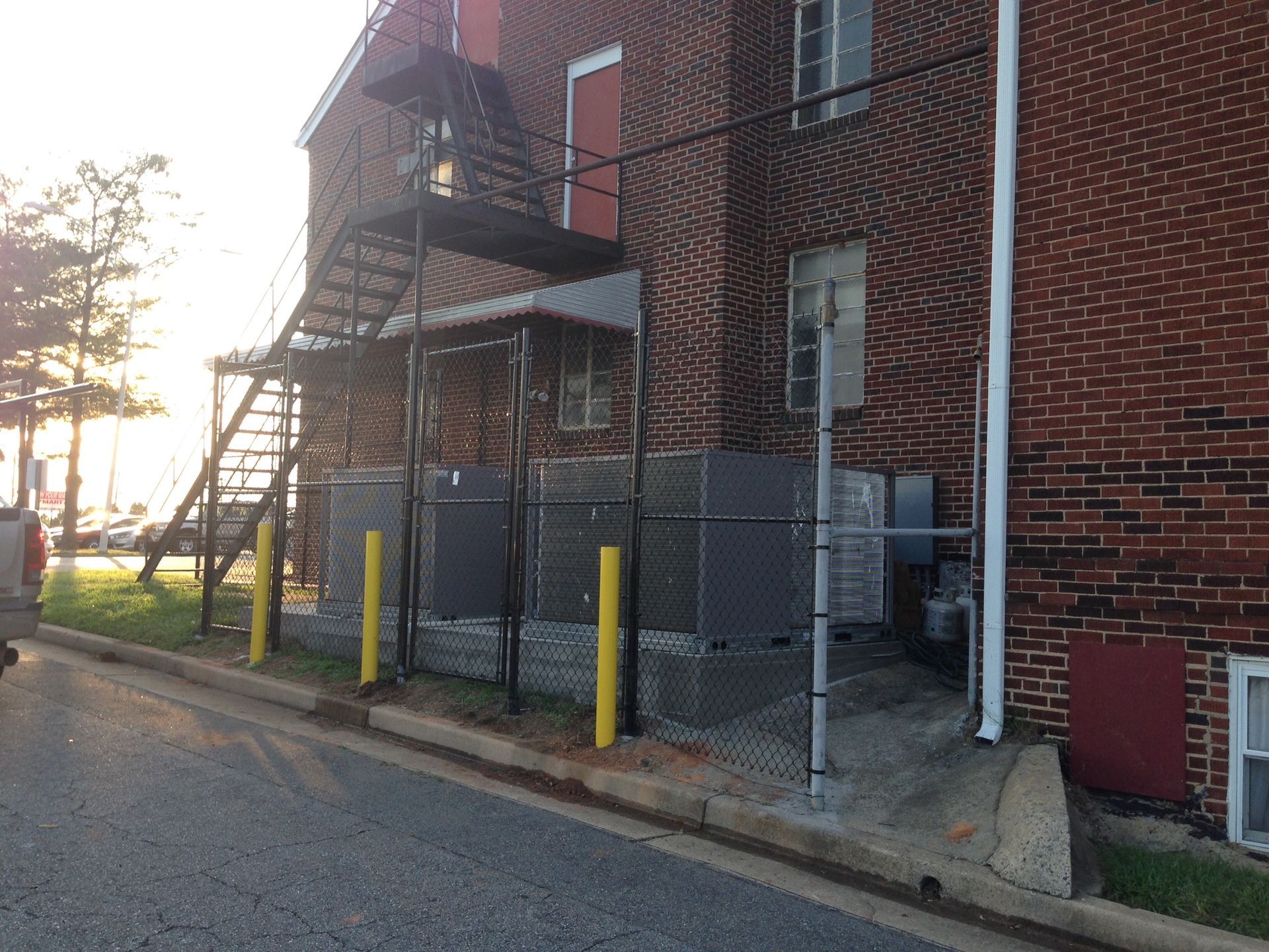 A brick building with stairs on the side of it