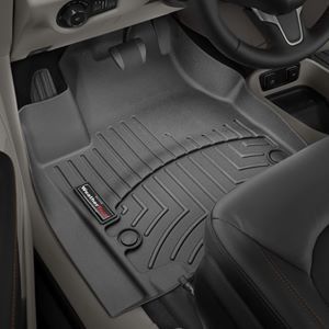 A close up of a car floor mat in a car.
