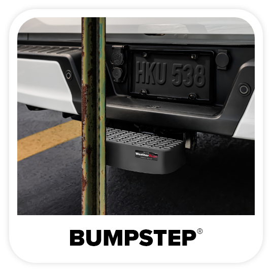 A white truck with a bumpstep