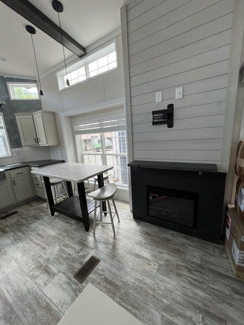 There is a fireplace in the middle of the room.
