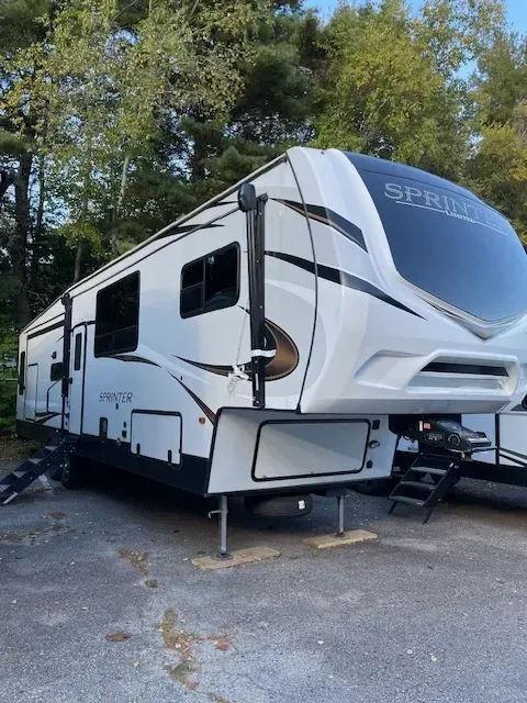 A white rv with the word spirit on the front