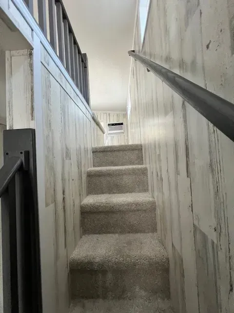 A set of stairs leading up to the second floor of a house.