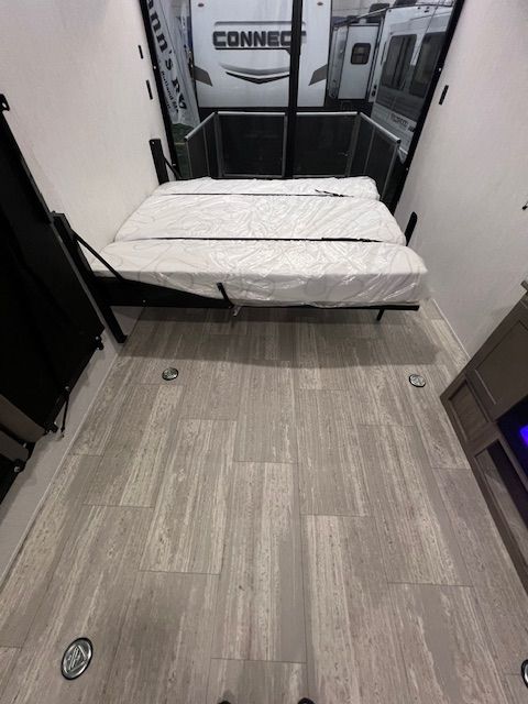 An RV with a bed that can be folded into a couch.