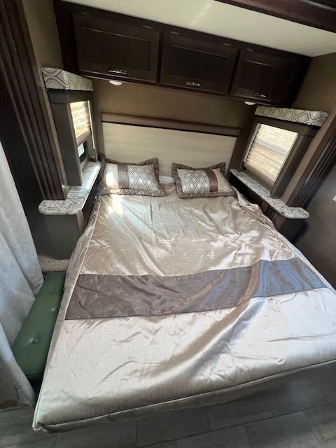 There is a large bed in the middle of the room.