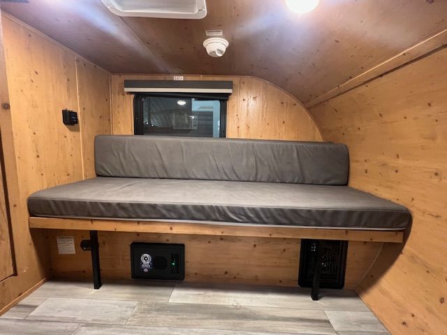 There is a couch in the middle of the room.