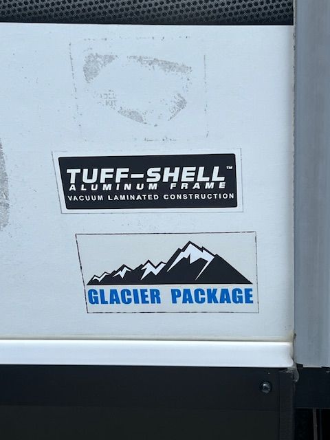 A sticker that says tuff-shell on it