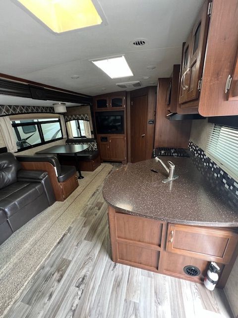 The inside of a RV with a couch and a table