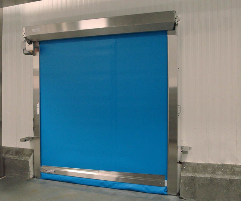 A blue door with a stainless steel frame is in a room.