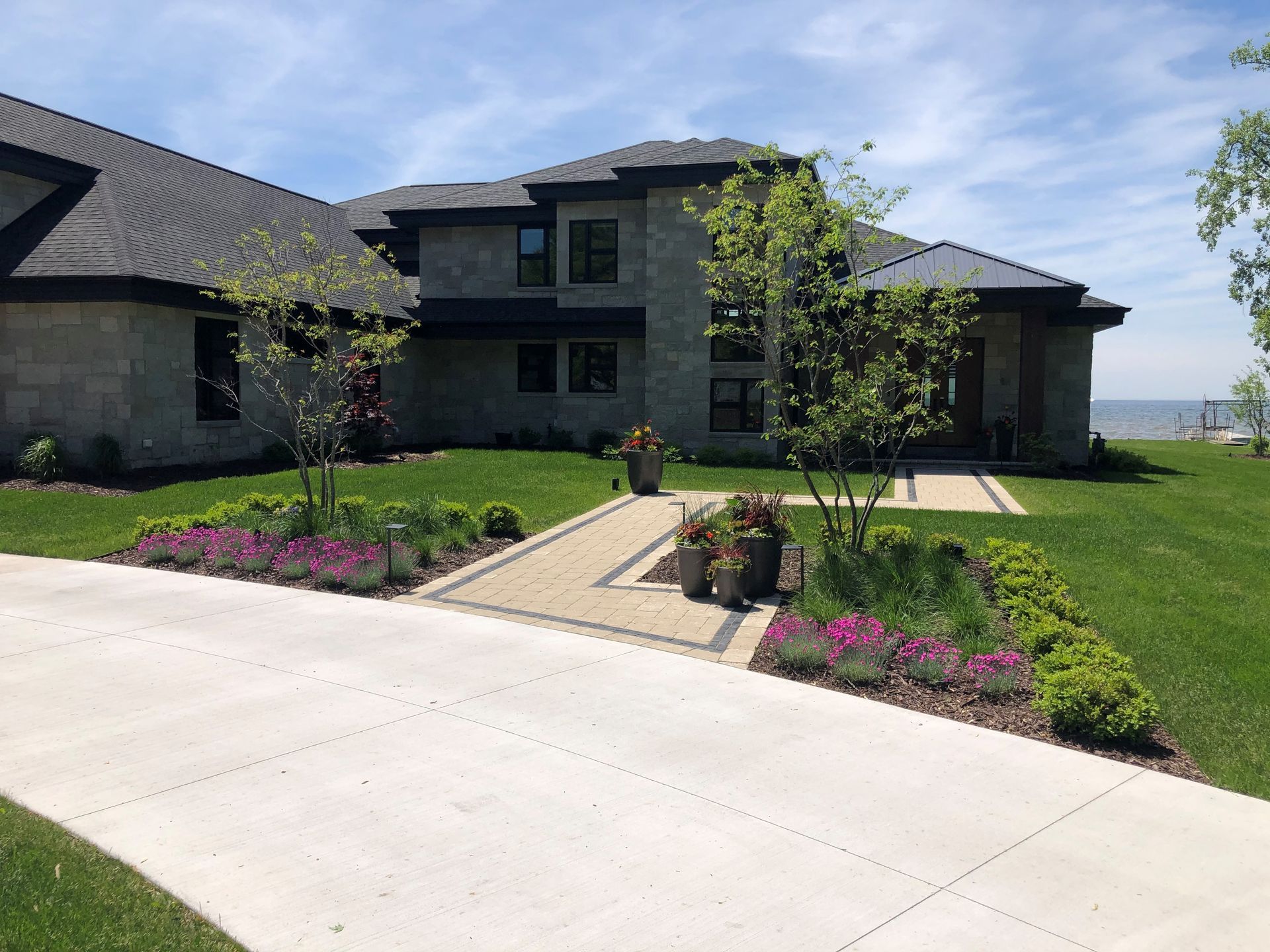 A large house with a driveway leading to it