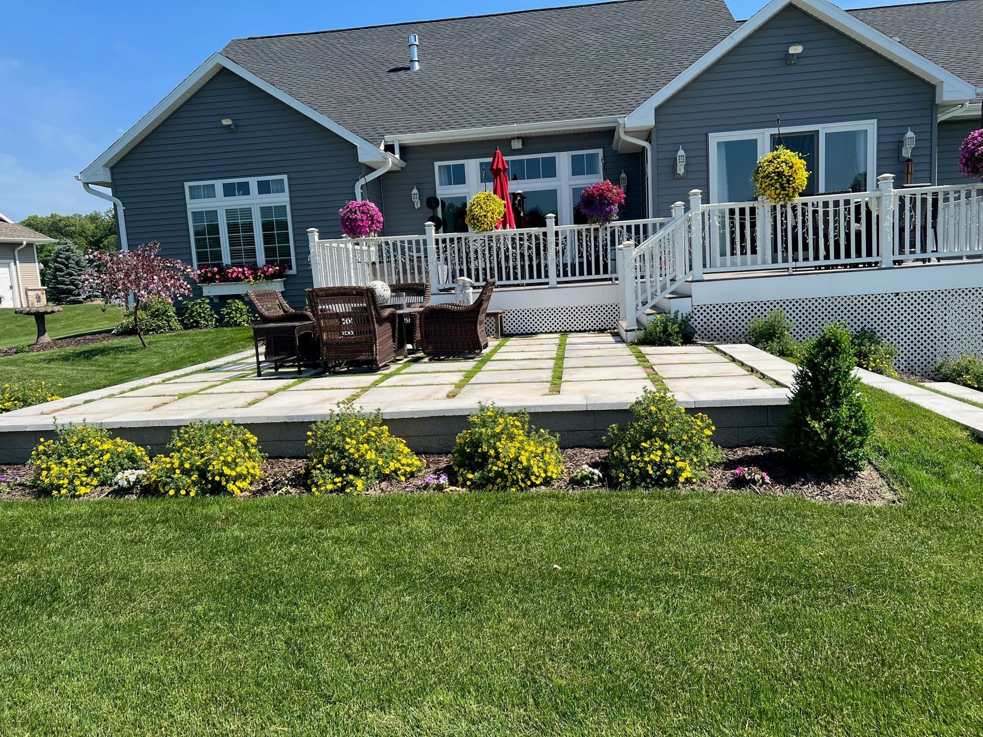A large house with a large patio in front of it