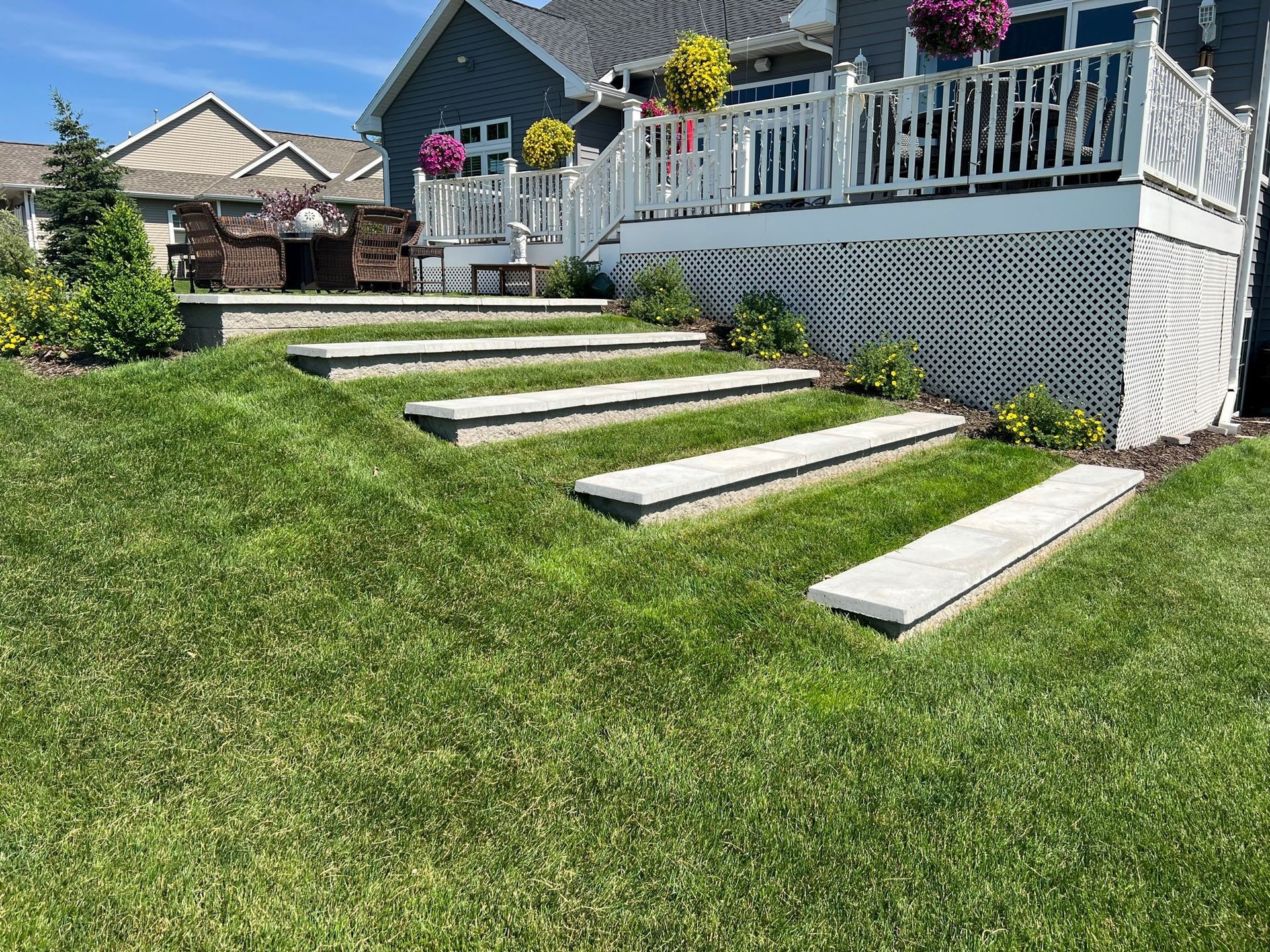 A house with a deck and stairs leading up to it