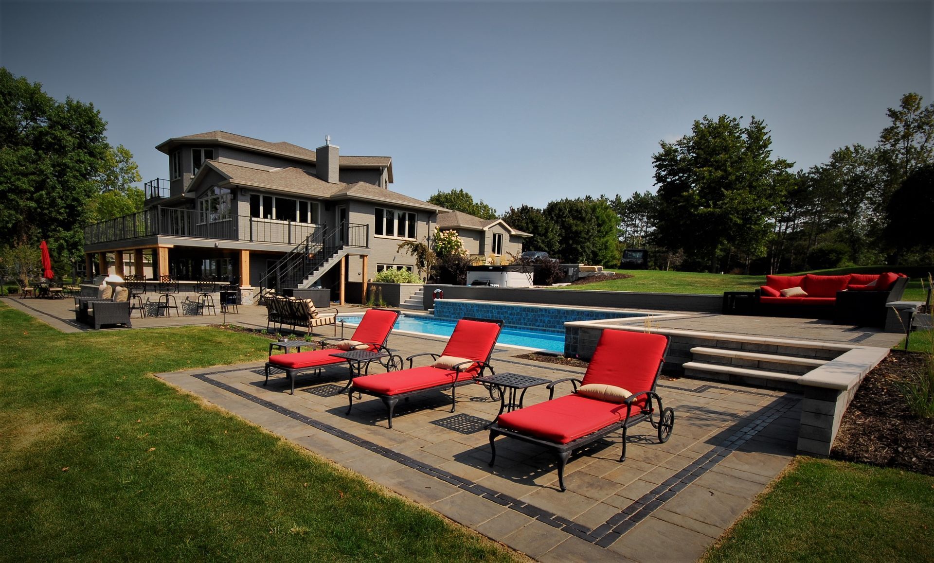 A large house with a swimming pool in the backyard