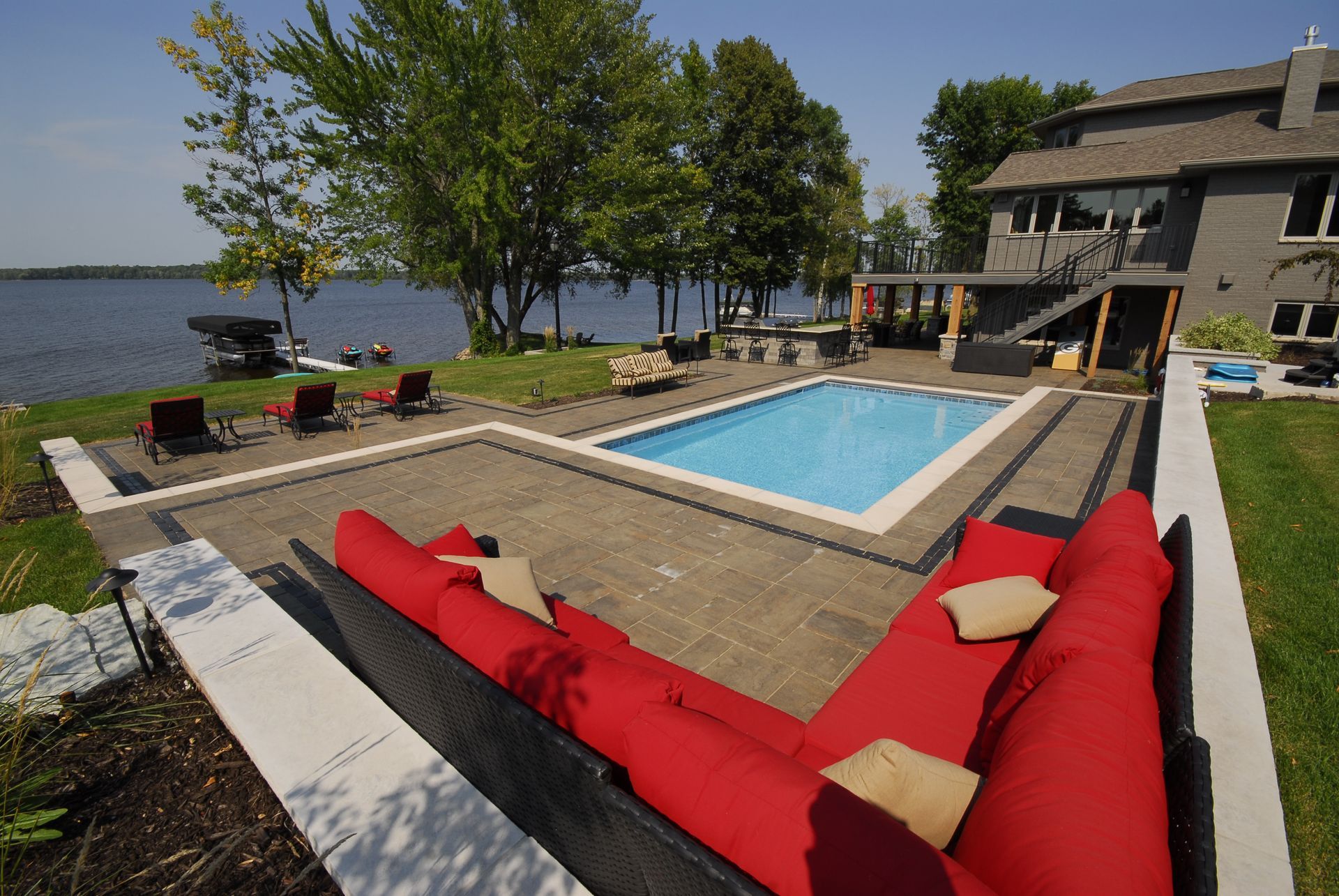A large swimming pool in the backyard of a house