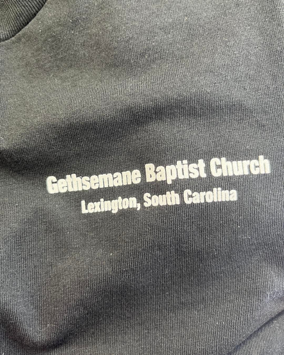 Text on a black garment: 