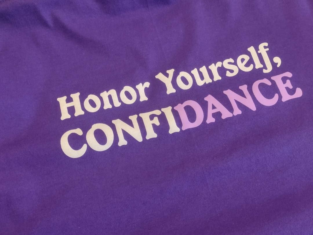 Purple fabric with text: 