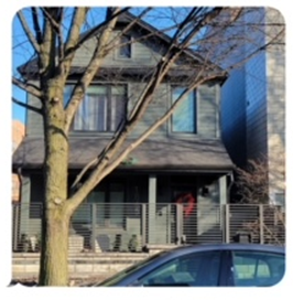 A house with a car parked in front of it