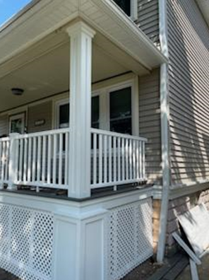 white deck with beige siding