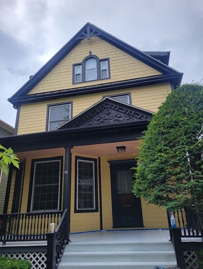 beautiful house with yellow siding