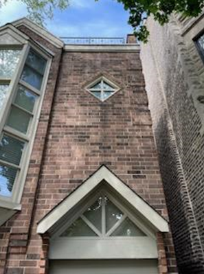 brick wall with diamond window on top