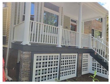 The front of a house with a porch and stairs