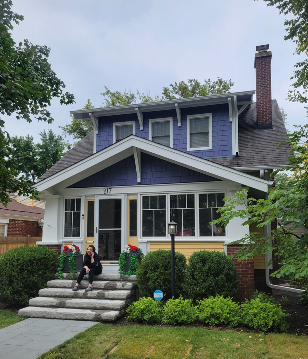 Front of purple and yellow house