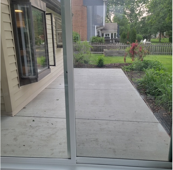 A house with a sliding glass door leading to a patio