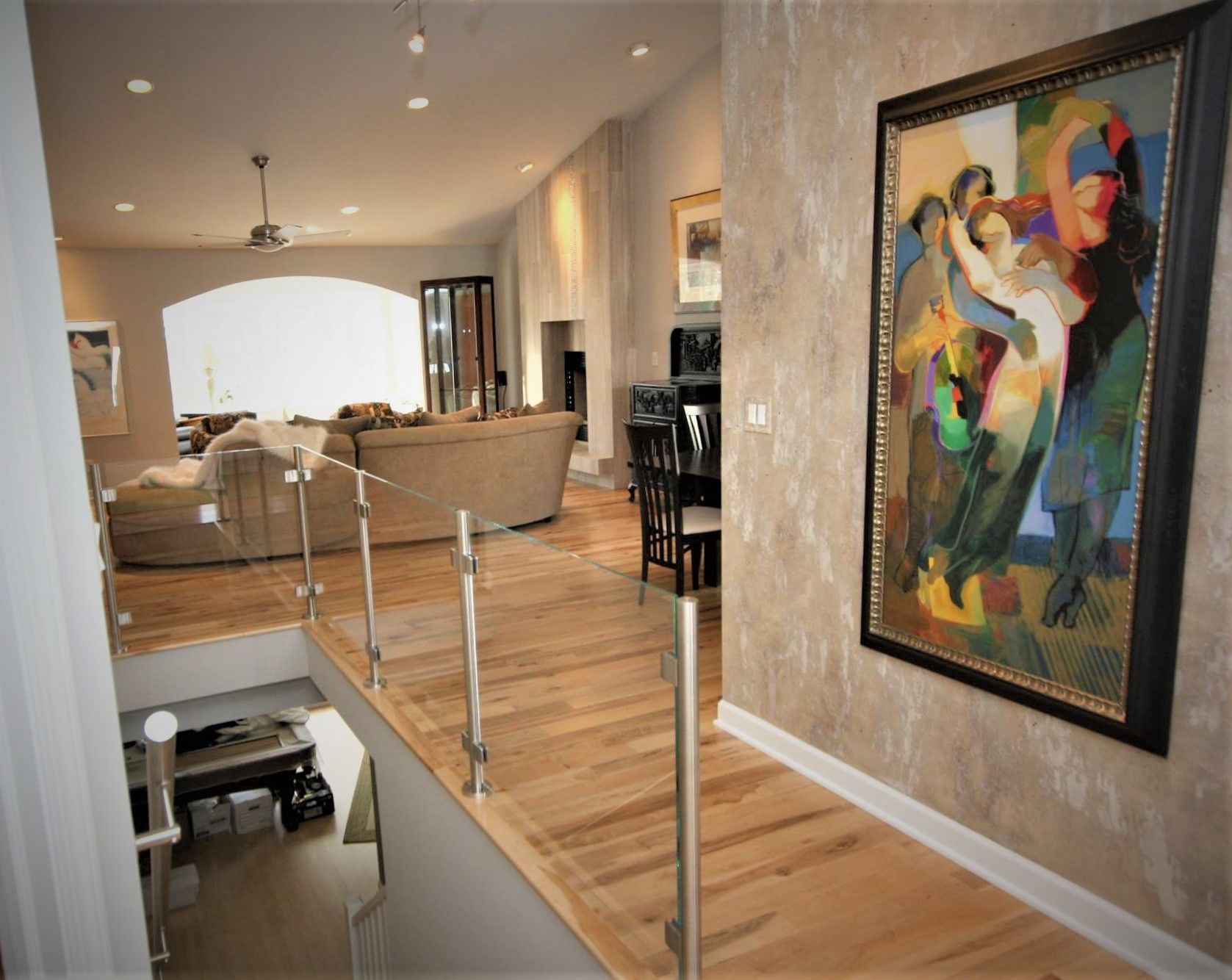 A living room with a painting on the wall