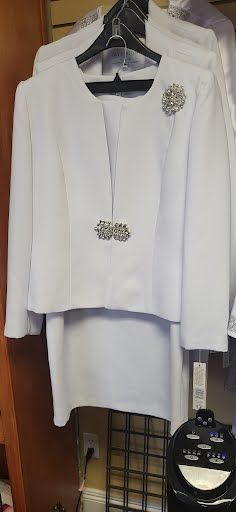 white top with silver details and white skirt