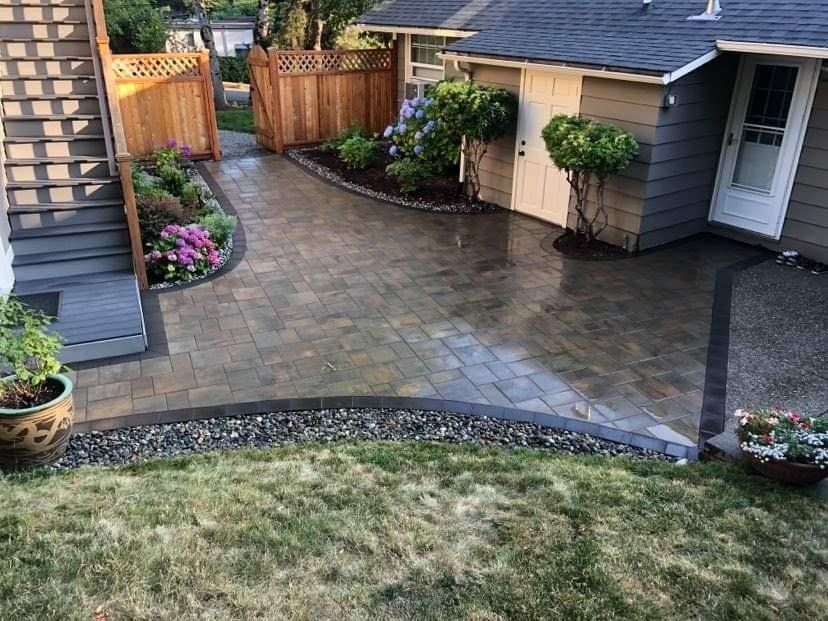 A house with a patio and a shed in the backyard.