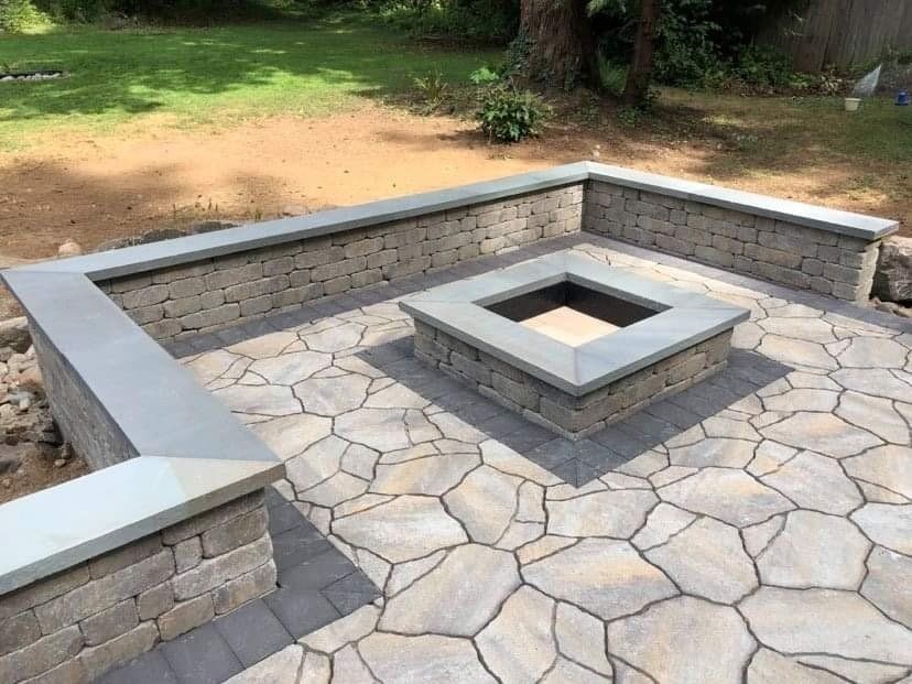 There is a fire pit in the middle of the patio.