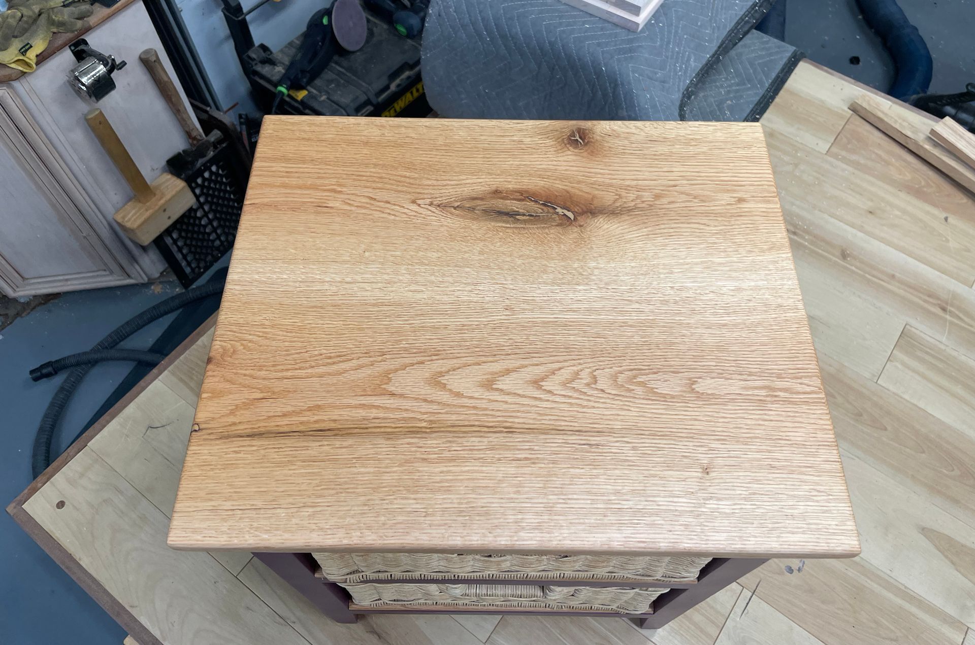 Wooden cabinet with top view of textured wood grain surface.