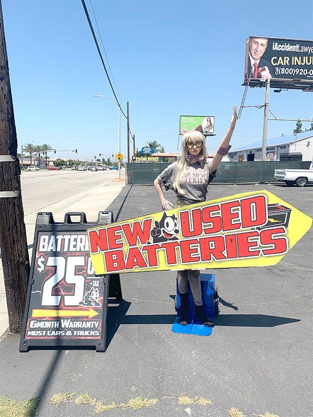 New and Used Batteries sign board