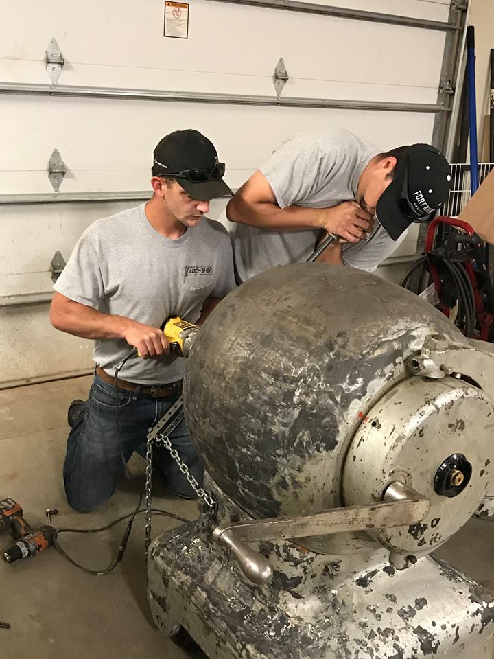 Men opening an old vault