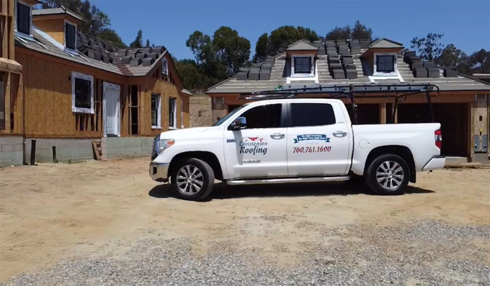 White pickup truck parked at a construction site.