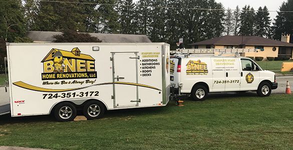 Company truck parked in a grassy field