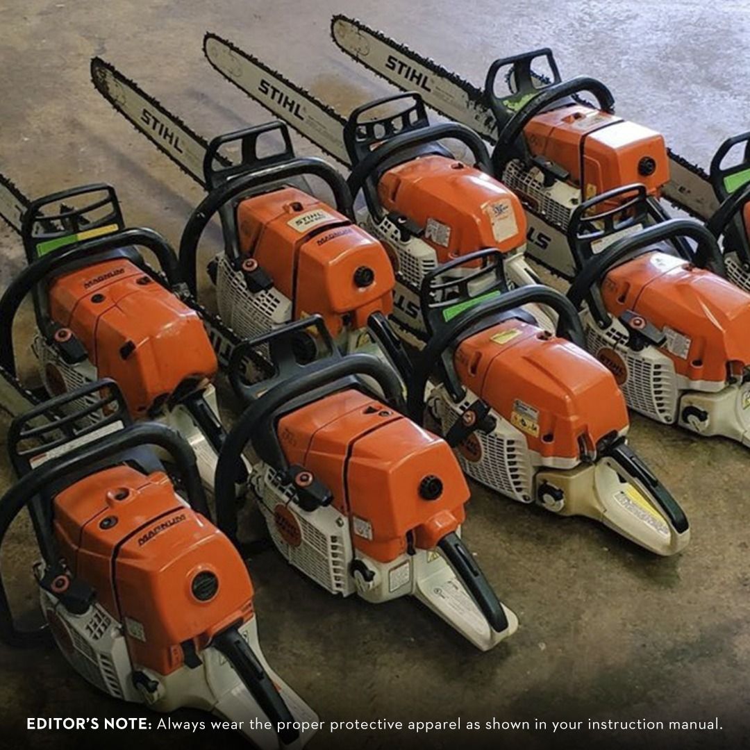 Several orange and silver STIHL chainsaws lined up, with visible blades.