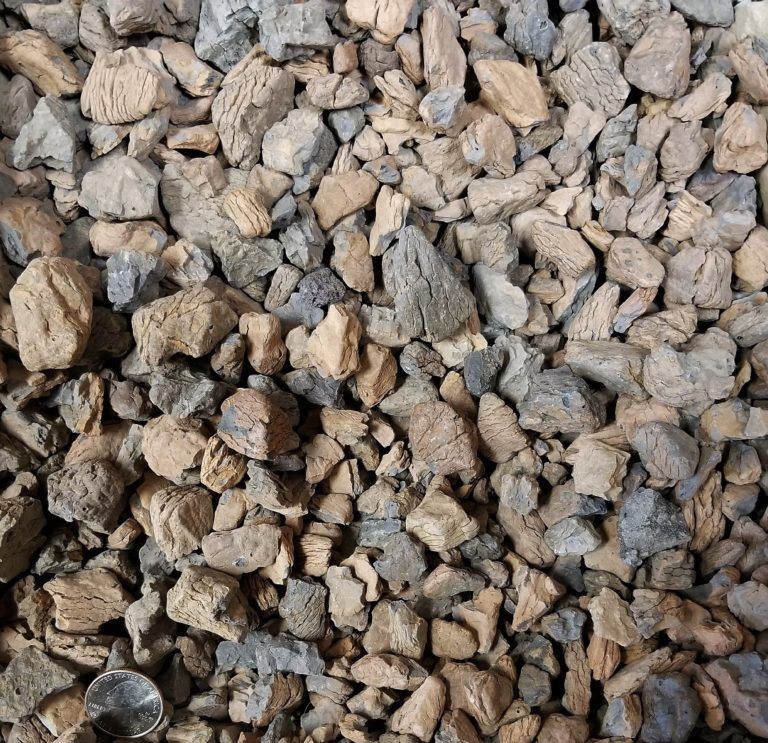 Close-up of beige and gray gravel stones filling the frame