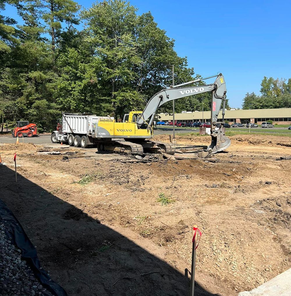 A yellow excavator with the word volvo on it