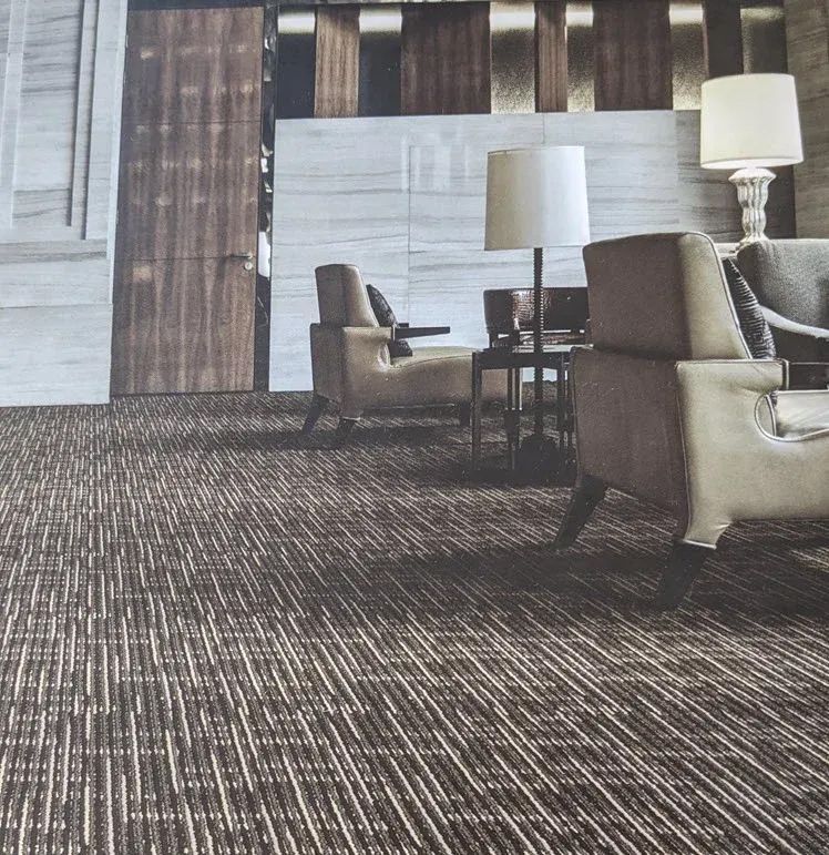 A living room with chairs and lamps on the floor