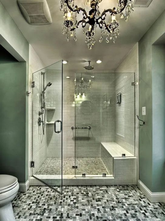 A bathroom with a walk in shower and a toilet