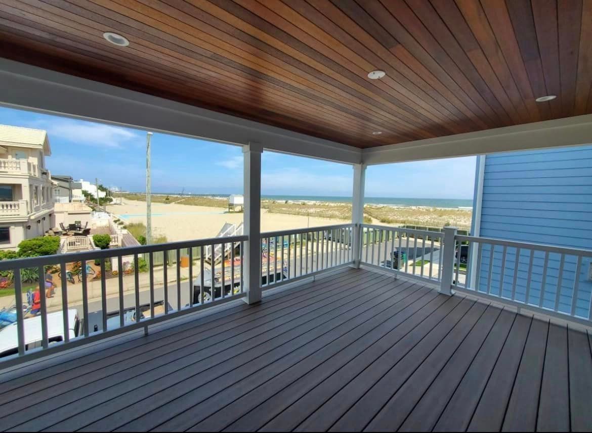 An empty deck with a view of the ocean